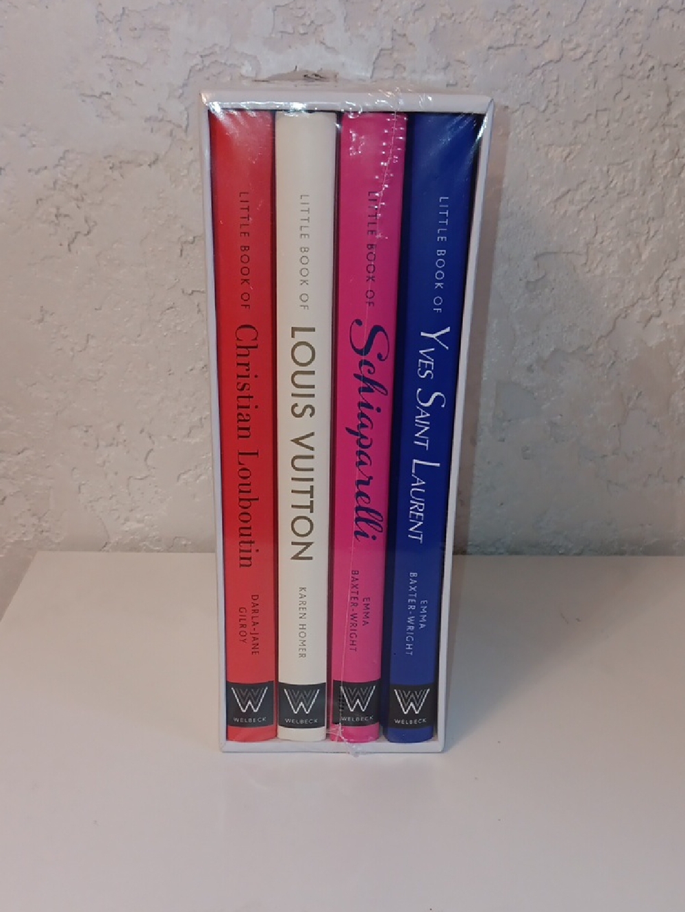 Set Of 4 Books Louis Vuitton, YSL, CL, and SCHIAPARELLI Coffee Table Books